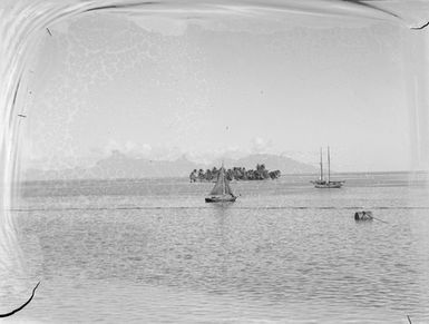 [Boats moored near Motu Uta island]