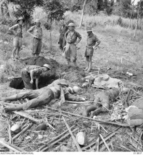 1942-12-14. PAPUA - GONA. AUSTRALIANS CAPTURED THE EASTERN PART OF GONA VILLAGE. BURIAL OF JAPANESE. (NEGATIVE BY G. SILK)
