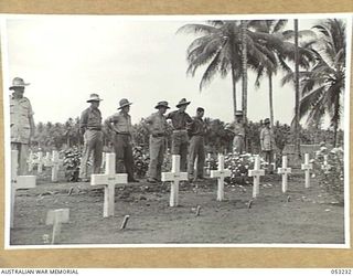 MILNE BAY, NEW GUINEA. 1943-06-26. SUNDAY AT MILNE BAY WAR CEMETERY BRINGS MANY FRIENDS TO PAY THEIR RESPECTS