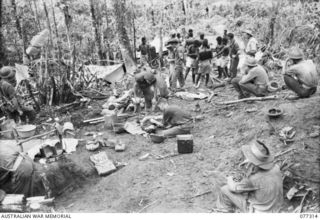 TOROKINA AREA, BOUGAINVILLE ISLAND. 1944-11-29. BATTLE CASUALTIES RECEIVING MEDICAL TREATMENT FOR WOUNDS RECEIVED DURING THE ATTACK BY D COMPANY, 9TH INFANTRY BATTALION, ON LITTLE GEORGE HILL