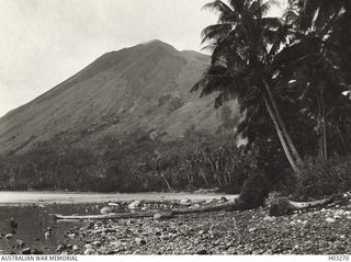 Nodup, New Britain. c. 1915. Mount  Kombiu  (mother) as seen from the side of Crater Peninsula opposite to Rabaul. Near the entrance to Blanche Bay, the Australian Submarine HMAS AE1 was lost with ..