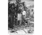 John Donofiro, Milton Wise and Earl Christman with stray dog, Bikini Atoll, summer 1947