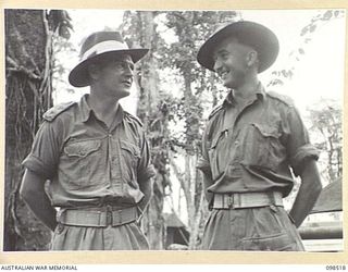 CAPE PUS, NEW GUINEA. 1945-11-03. LIEUTENANT A.N. PERMEZEL, ADJUTANT (1) AND CAPTAIN H.H. KELLY, ADMINISTRATIVE COMMANDER (2), OFFICERS OF 2/2 INFANTRY BATTALION