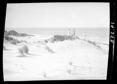 [Three women stand on sand dunes looking toward to the Pacific Ocean - Ocean Beach]