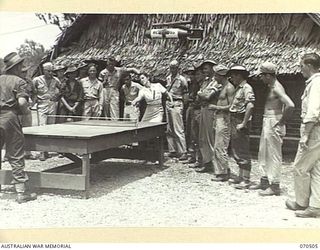 WARD'S DROME, PORT MORESBY AREA, PAPUA, 1944-02. AN AMERICAN RED CROSS HELPER, VIRGINIA RUGH, OF DECATUR, ILLINOIS, (1), PLAYING TABLE TENNIS WITH AN AUSTRALIAN SOLDIER AT THE AMERICAN RED CROSS ..