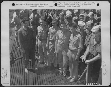 Los Negros, Admiralty Islands-Surviving officers of the two 13th AAF Consolidated B-24 "Liberators" from the 394th Bomb Squadron, 5th Bomb Group, shot down over Yap Island in the Caroline Group, pose with the crew of the submarine that rescued them. (U.S. Air Force Number 68144AC)