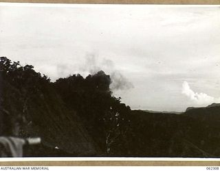 SHAGGY RIDGE, NEW GUINEA. 1943-12-27. 500 POUNDER BOMBS DROPPED FROM UNITED STATES ARMY FIGHTER AIRCRAFT EXPLODING ON JAPANESE POSITIONS ON THE "PIMPLE" DURING THE 2/16TH AUSTRALIAN INFANTRY ..