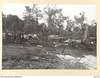 SORAKEN, BOUGAINVILLE. 1945-06-02. A SECTION OF THE CAMP AREA 2 MOUNTAIN BATTERY, SHOWING GUN POSITIONS AND THE ROUGH NATURE OF THE SURROUNDING COUNTRY. THEY HAVE BEEN IN THEIR PRESENT LOCALITY FOR ..
