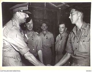 JACQUINOT BAY, NEW BRITAIN. 1945-07-01. HIS ROYAL HIGHNESS, THE DUKE OF GLOUCESTER, GOVERNOR-GENERAL OF AUSTRALIA (1), MEETING FIGHTER PILOTS IN THE SCRAMBLE HUT AT THE ROYAL NEW ZEALAND AIR FORCE ..