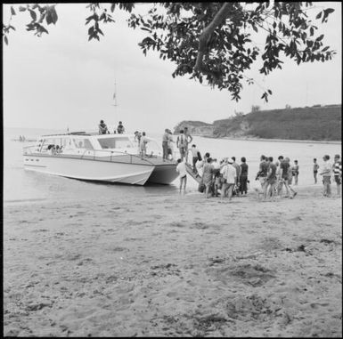 Tourists boarding a boat, Isle of Pines, New Caledonia, 1967 / Michael Terry