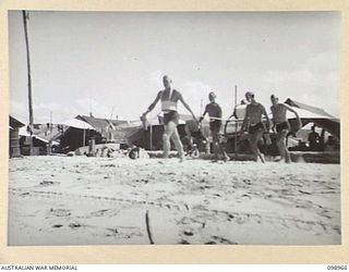 BORAM, NEW GUINEA. 1945-11-21. THE LIFE SAVING TEAM OF 30 INFANTRY BATTALION. IDENTIFIED PERSONNEL ARE:- CORPORAL J.P. SIMMONS, BELTMAN (1); PRIVATE L.G. PALLIER (2); SIGNALMAN J. BARROW (3); ..