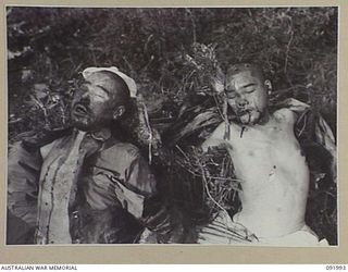 WEWAK POINT, NEW GUINEA, 1945-05-11. THE BODIES OF TWO JAPANESE SOLDIERS KILLED AT WEWAK. THE PHOTOGRAPH WAS REQUIRED BY INTELLIGENCE, 6 DIVISION FOR IDENTIFICATION PURPOSES. 2/4 INFANTRY BATTALION ..