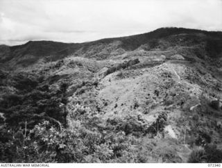 EFOGI, NEW GUINEA. 1944-04-07. LOOKING FROM MOUNT MYOLA TOWARDS MISSION HILL IN THE LEFT BACKGROUND, WITH THE EFOGI RIVER SIGNAL STATION IN THE CENTRE OF THE PICTURE. THE SIGNAL STATION WAS ..