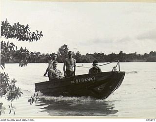 MILILAT, NEW GUINEA. 1944-08-23. PERSONNEL OF THE MOTOR TRANSPORT SECTION, HEADQUARTERS, 5TH DIVISION ENJOYING A TRIP IN "THE STREAK" A JAPANESE PORTABLE BOAT WHICH THEY SALVAGED AND FITTED WITH A ..