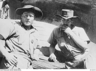 1942-10-01. NEW GUINEA. MILNE BAY. AUSTRALIAN FIGHTER PILOTS SQUADRON LEADER TRUSCOTT, D.F.C. AND SQUADRON LEADER L. JACKSON AFTER THE UNSUCCESSFUL JAPANESE ATTACK ON MILNE BAY. TRUSCOTT BECAME ..