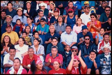 Crowd sitting in a grandstand,Tonga