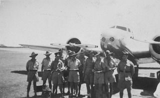 CLONCURRY, QLD, 1939-10-11. A GROUP COMPRISING SOME OF THE FIRST REGULAR SOLDIERS (GUNNERS) SENT TO REINFORCE THE GARRISON AT DARWIN, WITH MEMBERS OF THE DARWIN MOBILE FORCE ON THEIR WAY SOUTH TO ..