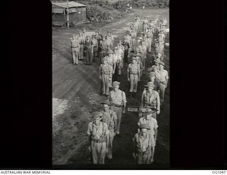 KIRIWINA, TROBRIAND ISLANDS, PAPUA. C. 1944-03. GROUP PORTRAIT OF AIRMEN OF NO. 30 (BEAUFIGHTER) SQUADRON RAAF ON COMMANDING OFFICER'S PARADE