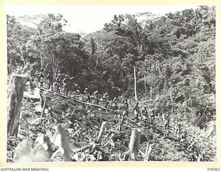 TAMKAIDAN, NEW BRITAIN. 1945-01-15. AN ALLIED INTELLIGENCE BUREAU PATROL, IN CHARGE OF QX4869 LIEUTENANT J. SAMPSON, SETTING OUT FROM THE UNIT HEADQUARTERS