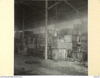 LAE, NEW GUINEA. 1944-09-27. A SECTION OF ONE OF THE STORAGE SHEDS OF THE 43RD FIELD ORDNANCE DEPOT