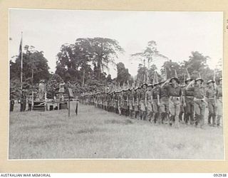 BOUGAINVILLE. 1945-06-08. GENERAL SIR THOMAS A. BLAMEY, COMMANDER-IN-CHIEF, ALLIED LAND FORCES, SOUTH WEST PACIFIC AREA, TAKING THE SALUTE FROM TROOPS OF 7 INFANTRY BRIGADE, DURING THE MARCH PAST ..