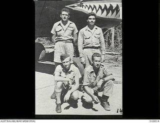 PORT MORESBY, PAPUA. C. 1943. RAAF AND USA AIRMEN WHO FLY TOGETHER AS THE CREW OF AN AMERICAN B-25 MITCHELL BOMBER AIRCRAFT. KNEELING IN FRONT, LEFT TO RIGHT: SERGEANT THOMAS S. F. MONK RAAF OF ..