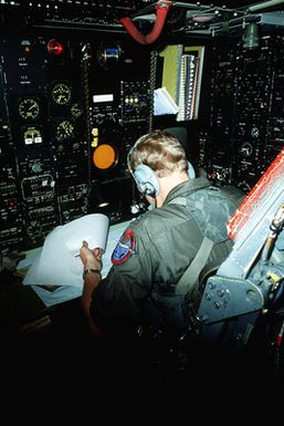 A navigator aboard a B-52H Stratofortress aircraft mans his position during a flight from Guam to Darwin Royal Australian Air Force Base, Australia. The navigator, assigned to the 37th Bomb Squadron, is a participant in Exercise Glad Customer '82