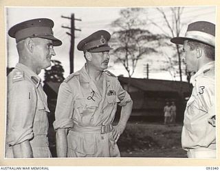 LAE AREA, NEW GUINEA, 1945-06-30. DURING HIS TOUR OF INSPECTION OF GLOUCESTER, GOVERNOR-GENERAL OF AUSTRALIA (2) VISITED 2/4 FIELD BUTCHERING PLATOON. PICTURED ABOVE, DISCUSSING BREED, NATURE OF ..