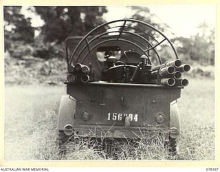 LAE, NEW GUINEA. 1945-01-03. A JEEP TRAILER OF THE 34TH WIRELESS TELEGRAPHY SECTION (HEAVY), LOADED UP WITH ALL THE EQUIPMENT NECESSARY FOR THE SETTING UP OF A MOBILE RADIO STATION FOR THE 19TH ..