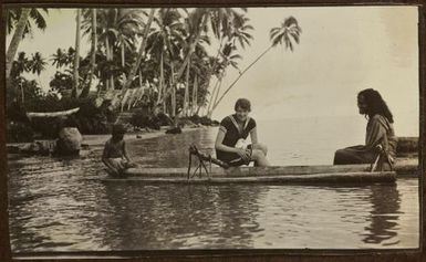 Two women and a boy in a canoe. From the album: Samoa