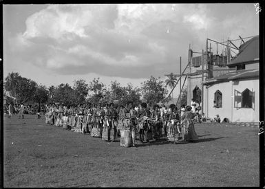 Group of women outdoors, wearing clothing including tapa cloth, probably Fiji