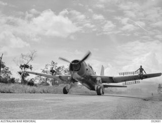 NADZAB, NEW GUINEA. C. 1944-02. A VULTEE VENGEANCE DIVE BOMBER AIRCRAFT OF NO. 21 SQUADRON RAAF TAXIING TO ITS DISPERSAL BAY AFTER A DIVE BOMBING RAID ON JAPANESE POSITIONS, WITH RIGGERS SITTING ON ..