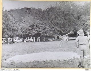 PORT MORESBY - F/O K.M. HAMPSHIRE, WINNING HOP-STEP AND JUMP AT A.A.C. SPORTS. (NEGATIVE BY N. TRACY)