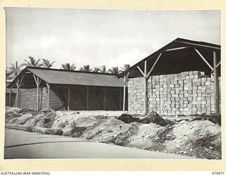 PALMALMAL PLANTATION, NEW BRITAIN. 1945-03-09. WELL FILLED STOREHOUSES AT THE 31ST STORES DEPOT COMPANY