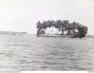 MATUPI, NEW BRITAIN. 1944-08-18. ONE OF THE MANY AND UNUSUAL CORAL ISLANDS SEEN BY THE CREW OF THE MEDICAL LAUNCH OF THE NEW GUINEA SEA AMBULANCE TRANSPORT COMPANY DURING THE DAILY RUN BETWEEN ..