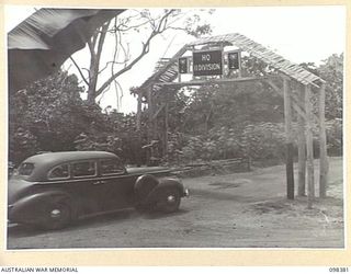 RABAUL, NEW BRITAIN. 1945-10-27. OFFICIAL CAR CARRYING GENERAL SIR THOMAS A. BLAMEY, COMMANDER-IN-CHIEF, ALLIED LAND FORCES, SOUTH WEST PACIFIC AREA; MAJOR GENERAL K.W. EATHER, GENERAL OFFICER ..
