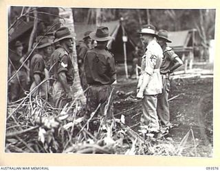 TOL PLANTATION, WIDE BAY, NEW BRITAIN. 1945-07-02. HIS ROYAL HIGHNESS, THE DUKE OF GLOUCESTER, GOVERNOR-GENERAL OF AUSTRALIA (4), SPEAKING WITH A WEST AUSTRALIAN SOLDIER, SERGEANT G.R. MILLER (2). ..