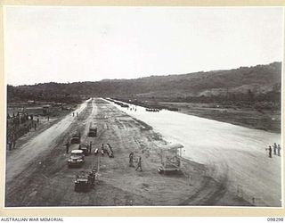 WEWAK, NEW GUINEA. 1945-10-26. A CEREMONIAL PARADE AND MARCH PAST BY 6 DIVISION WAS INSPECTED BY GENERAL SIR THOMAS A. BLAMEY, COMMANDER-IN-CHIEF, ALLIED LAND FORCES, SOUTH WEST PACIFIC AREA, AT ..