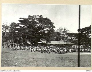 MADANG, NEW GUINEA. 1944-10-29. NX142933 CHAPLAIN W.C. CORR, ASSISTED BY VX53162 CHAPLAIN D.E.J. TOOHY AND VX133080 CHAPLAIN J.J. RYAN CELEBRATING SOLEMN HIGH MASS FOR ALLIED TROOPS ON THE LOCAL ..