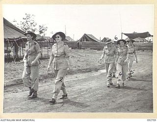 WEWAK AREA, NEW GUINEA. 1945-06-03. AUSTRALIAN ARMY NURSING SERVICE SISTERS FROM 104 CASUALTY CLEARING STATION MOVING TO THEIR RESPECTIVE WARDS FOR DUTY. IDENTIFIED PERSONNEL ARE:- LIEUTENANT K.J. ..