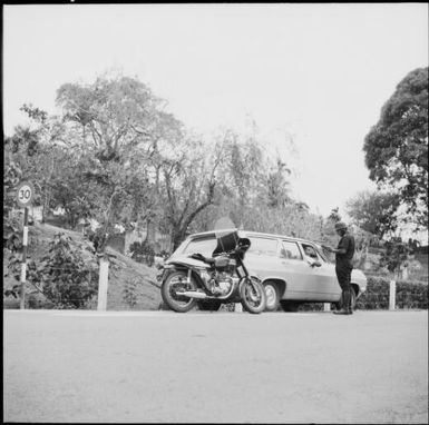 A police officer booking a speeding driver, Fiji, November 1966 / Michael Terry