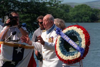 CAPT Donald K. Ross, USN (Ret.), a survivor of the Japanese attack on Pearl Harbor and a Medal of Honor recipient, leads the audience in a rendition of God Bless America during the dedication of the USS NEVADA MEMORIAL at Hospital Point. The dedication is taking place as part of an observance commemorating the 50th anniversary of the Japanese attack