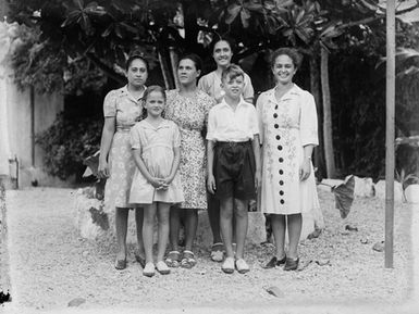 [Group portrait of four women and two children]