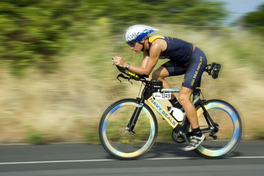 U.S. Navy Special Operations CHIEF Mitch Hall, assigned to the Naval Special Warfare Center, road tests his Navy SEAL racing bike prior to the start of the 2006 Iron-man Triathlon World Championship competition at Kailua-Kona, Hawaii, on Oct. 20, 2006. This year's event marks the second time that Hall was officially sponsored by his command to assist in the Sea, Air, and Land Unit recruiting efforts. (U.S. Navy photo by Mass Communication SPECIALIST 3rd Class Ben A. Gonzales) (Released)