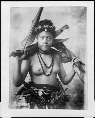Young Samoan woman holding leaves - Photograph taken by Thomas Andrew