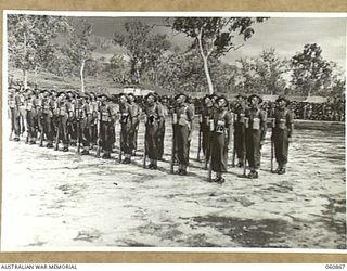 NEW GUINEA. 1943-11-20. THE GUARD OF THE 2/9TH. AUSTRALIAN INFANTRY BATTALION BEING INSPECTED DURING THE BRIGADE GUARD MOUNTING CHAMPIONSHIPS AT THE 18TH AUSTRALIAN INFANTRY BRIGADE SPORTS MEETING ..