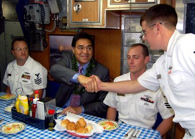 At Pearl Harbor, Hawaii (HI), Honolulu Mayor the honorable Mufi Hannemann, visits with crew members onboard the Pearl Harbor based USN Los Angeles Class Attack Submarine USS HONOLULU (SSN 718), to bid farewell to the nuclear-powered attack submarine that has served as the city's namesake for the past two decades