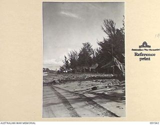 SORAKEN AREA, BOUGAINVILLE ISLAND, 1945-04-02. LOOKING TOWARDS TAIOF ISLAND ALONG THE BEACH FROM THE CAMP AREA, A COMPANY, 26 INFANTRY BATTALION