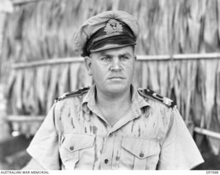 LAE, NEW GUINEA. 1945-10-05. LIEUTENANT (S) J.H.H. PATERSON, ROYAL AUSTRALIAN NAVAL RESERVE, DEPUTY SUPERVISING INTELLIGENCE OFFICER, NEW GUINEA, AND OFFICER- IN- CHARGE, ALLIED INTELLIGENCE ..