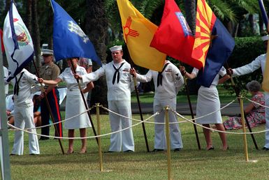 Crew members from the present day USS NEVADA (SSBN-722), a nuclear-powered strategic missile submarine, present the colors during the dedication ceremony of the USS NEVADA Memorial at Hospital Point, named in honor of the battleship struck during the Japanese attack on Pearl Harbor. The dedication is taking place as part of an observance commemorating the 50th anniversary of the attack